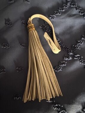 Yves Saint Laurent YSL Leather Tassel Keychain in Cream with Gold